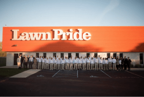 Lawn Pride crew in front of building